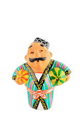 Ceramic statuette of Uzbek man wearing in traditional costume with watermelon and honeymelon isolated with work path.