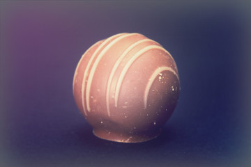 Dellicious luxury chocolate on a dark background