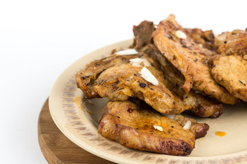 Fried pork chops served on the plate isolated over white background