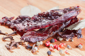 Pieces of beef jerky and spices