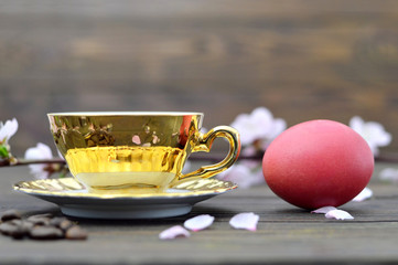 Easter breakfast with Easter egg and cup of tea