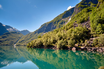 Bondhussoen with green tree covered slopes in the foreground