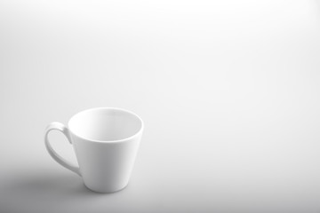  A white cup on while background