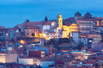 Naklejka na ściany i meble Picturesque aerial view of Historical part of Porto during evening blue hour, Portugal