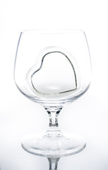 Heart shape glass in wine glass
