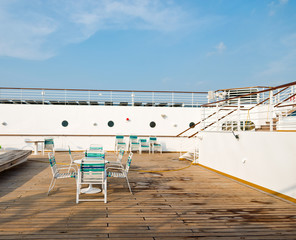 row of sun chairs  on the ship deck