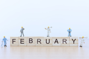 February words with Miniature people worker