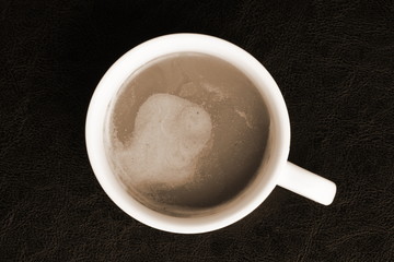 Coffee in the cup on sepia scene represent the hot beverage concept related idea.