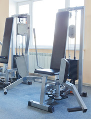 Fototapeta na wymiar Fitness machines in a fitness club