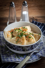 Dumplings with meat, onion and bacon.