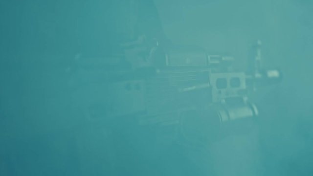 Assault rifle kalashnikov. Closeup of ak 47 machine gun on soldier. Soldier rifle 5.45 caliber. Grenade launcher on kalashnikov rifle. Machine gun ak 47 in fog