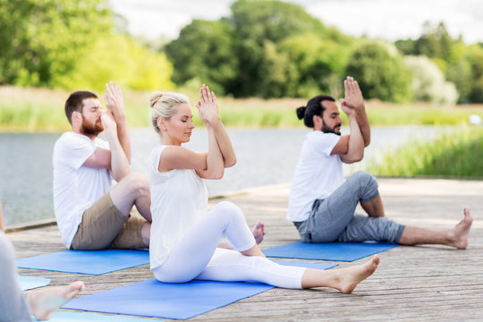 people making yoga and meditating outdoors