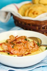 Shrimp and grits  with corn muffins on side, selective focus