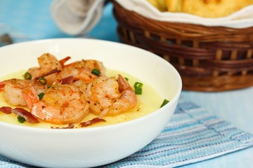 Shrimp and grits  with corn muffins on side, selective focus