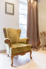 Elegant green armchair in classic style