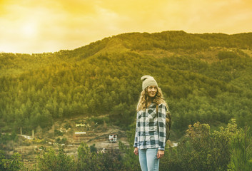 Young woman traveler in chekered shirt hiking in the mountains, Dim Cay district of Alanya, Antalya province, Mediterranean Turkey