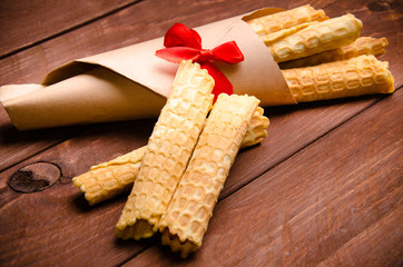 tubular wafer. waffles on wooden boards.