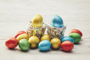 Colorful Easter eggs with stands of silver foil