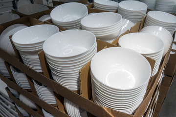 A lot of white plates in the store