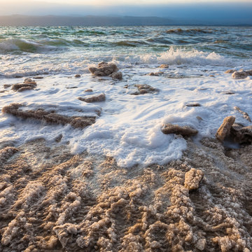 crystalline coast of Dead Sea on winter evening