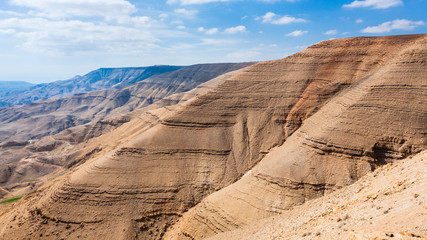 Fototapeta na wymiar sedimentary mountain in valley of Wadi Mujib river
