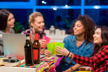 Female friends clanging glasses together