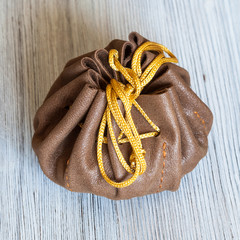 above view of small tied leather purse