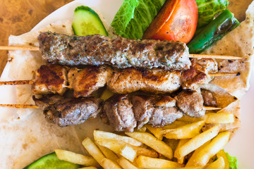 top view of skewers with various arabian kebabs