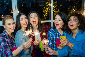 Cheerful female friends having fun at celebration