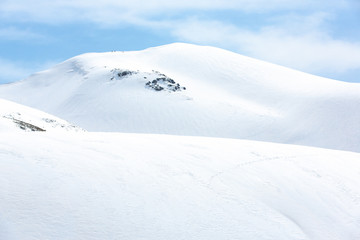 Lots of footprints in the snow covered mountain - 143064780