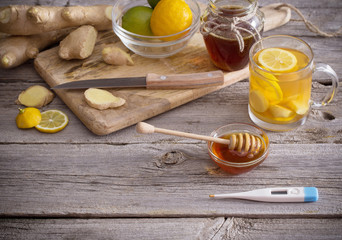  Ginger tea and ingredients on a  grunge wooden background