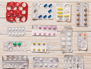 medical pills, antibiotics on a wooden background