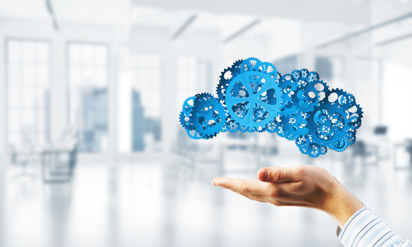 Man presenting in his palms cloud computing concept as mechanism of cogwheels