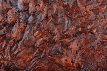 Oxidized, crumpled, rusty copper sheet. Copper background.