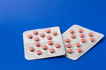 Various pills blister pack on color background