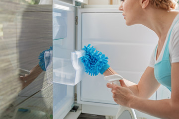 Concentrated female person opening fridge