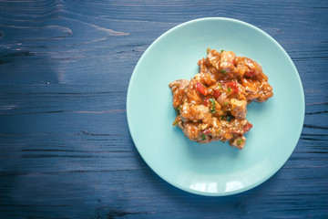 Meat stew on a blue plate