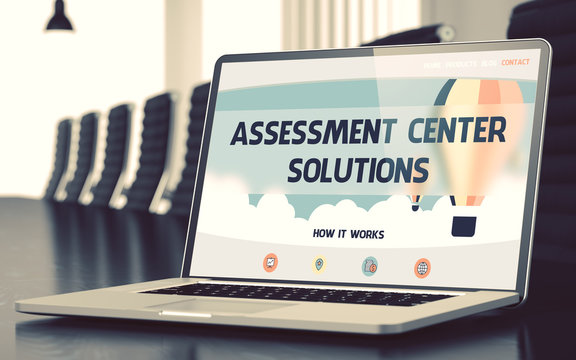 Assessment Center Solutions on Landing Page of Laptop Screen. Closeup View. Modern Meeting Room Background. Blurred Image with Selective focus. 3D.