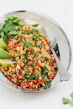 Tabbouleh.Traditional bulgur salad with vegetables and herbs. Selective focus