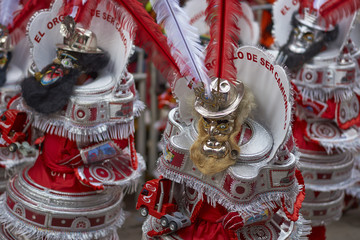 Masked Morenada dancers in ornate costumes parading through the mining city of Oruro on the Altiplano of Bolivia during the annual carnival.