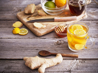  Ginger tea and ingredients on a  grunge wooden background