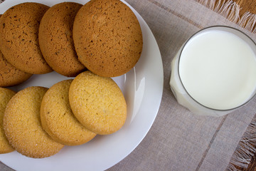Milk in a glass and cookies, breakfast.