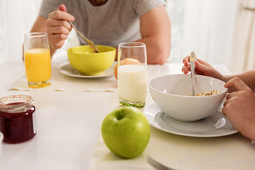 Father and son having healthy breakfast