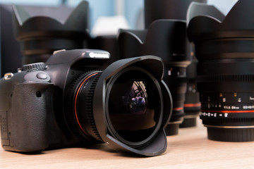 Fototapeta na wymiar Digital SLR camera with a fisheye lens.