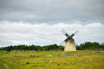 Landscape with stormy sky and windmill in Gotland, Sweden