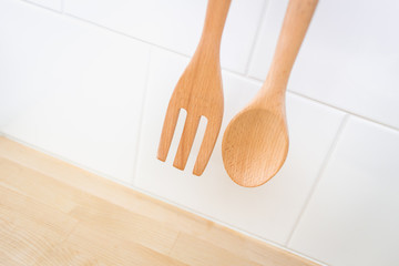 Kitchen decoration Wood spoon and folk in clean new home cuisine.