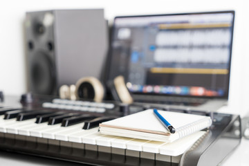 Obraz premium Blank notebook on music studio for song writing