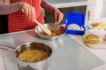 Woman preparing tasty breakfast at home