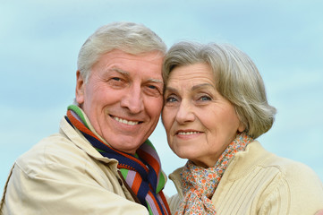 Happy elderly couple embracing