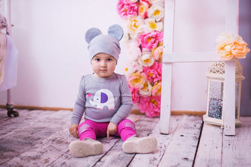 Newborn baby girl in a mouse cap